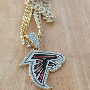 Unk Gold-Tone Falcon Logo Pendant Necklace with Black and Red Enamel